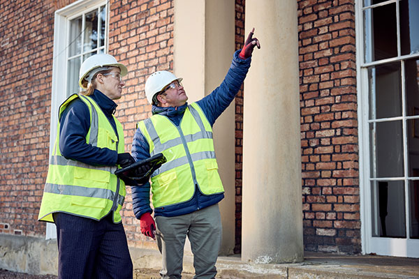 Team examining building